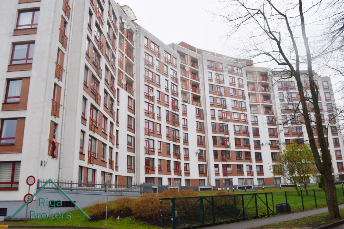 Apartment building with red accents.