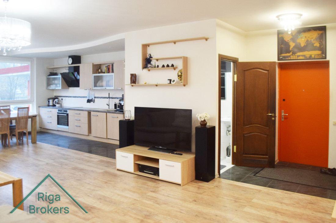 Kitchen with TV area and entrance door