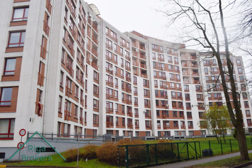 Apartment building with red accents.
