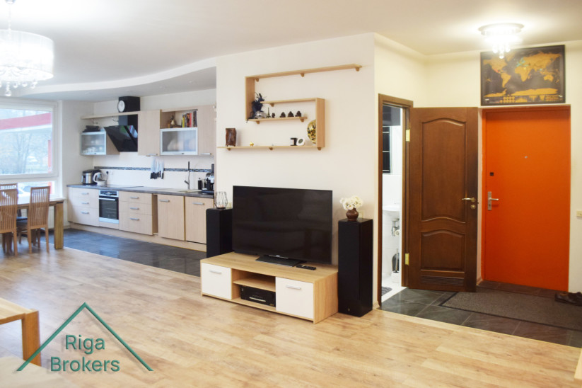 Kitchen with TV area and entrance door