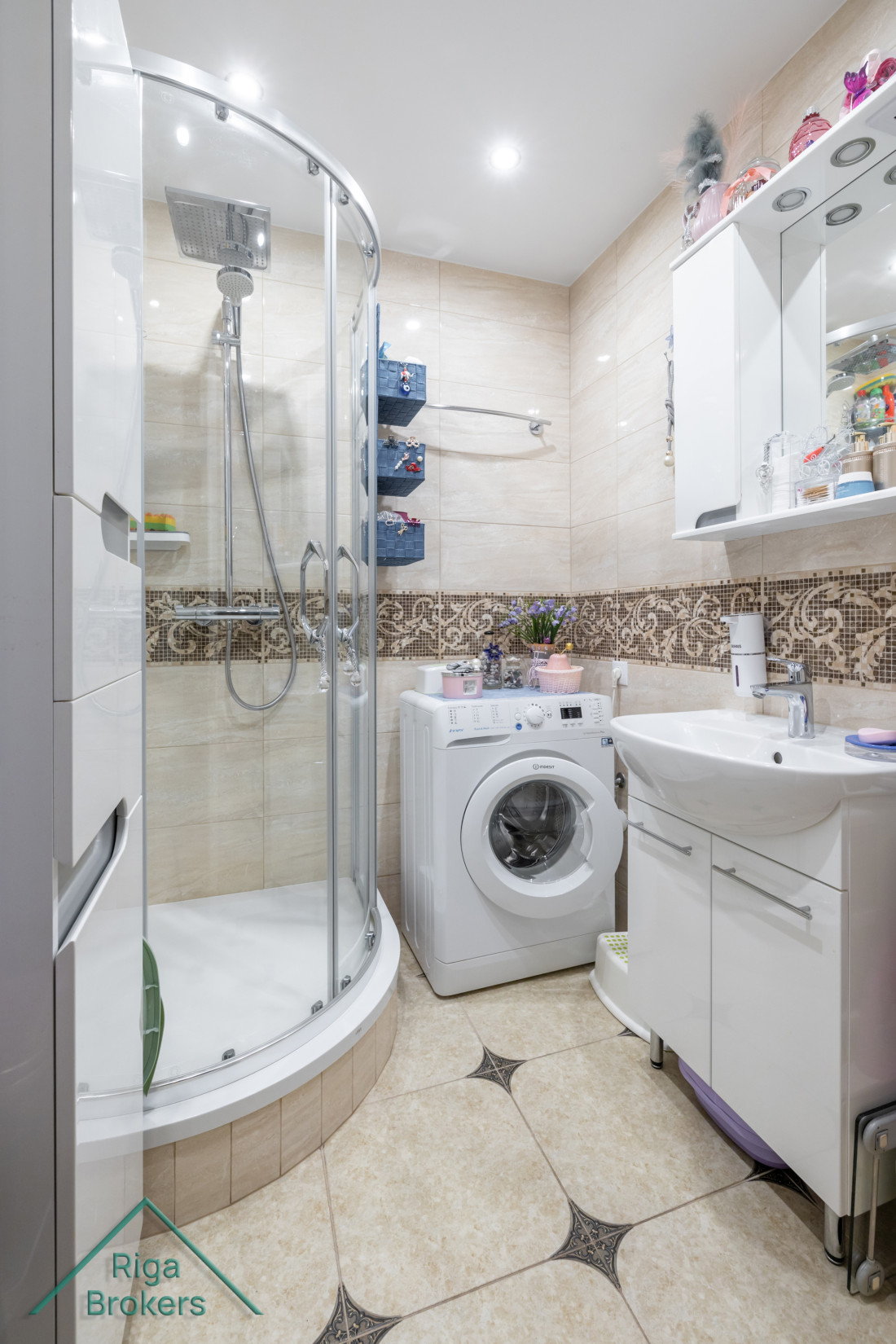 Bathroom with shower and washing machine.