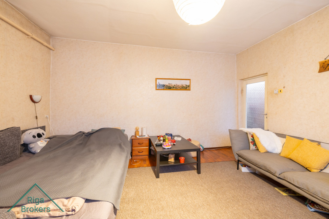 Room with bed and table.