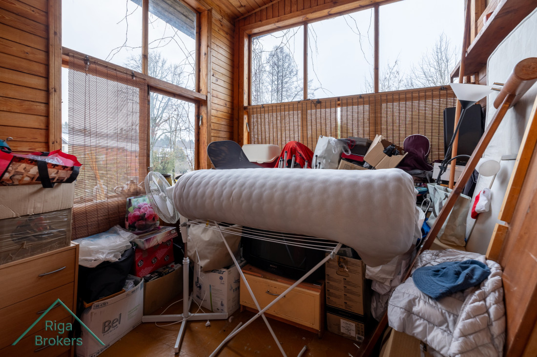 Wooden veranda with various items.