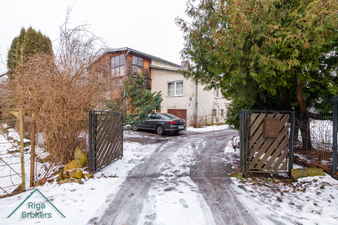 Private house with entrance and open gate.