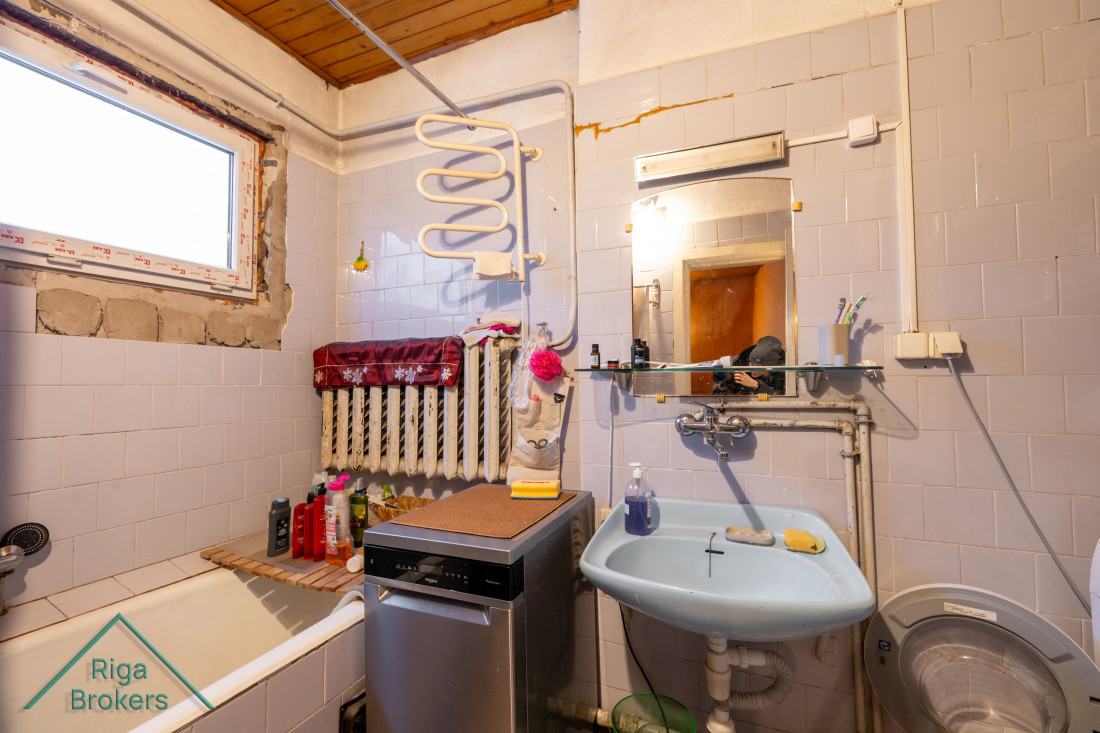 Bathroom with sink and radiator.