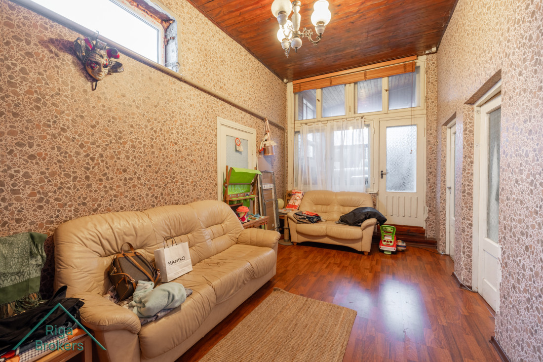 Spacious hallway with two sofas.