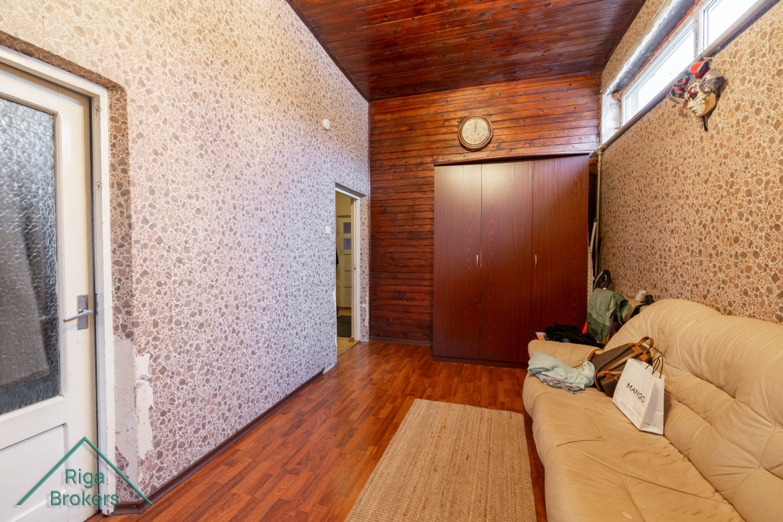 Hallway with sofa and wardrobe.