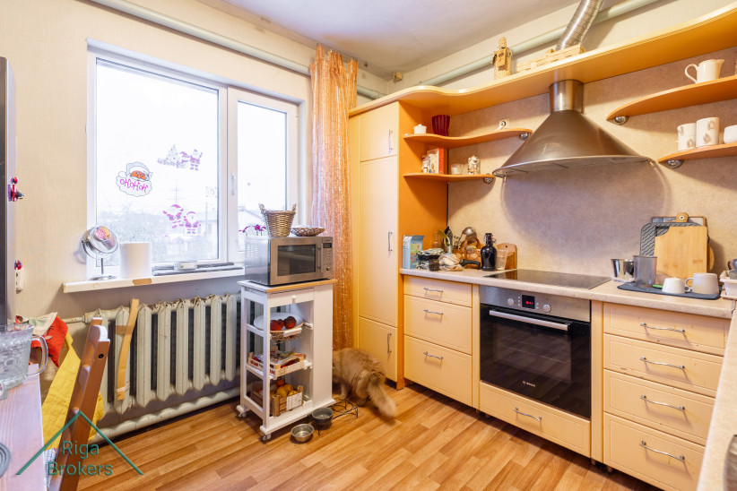 Kitchen with window and appliances.