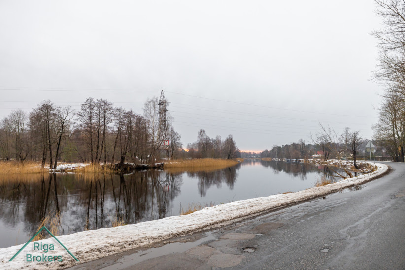 River with winter landscape and trees.