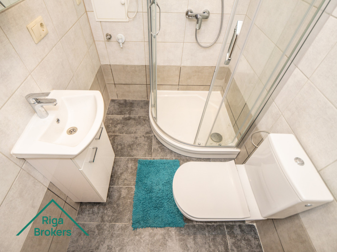 White bathtub, shower, toilet, sink.