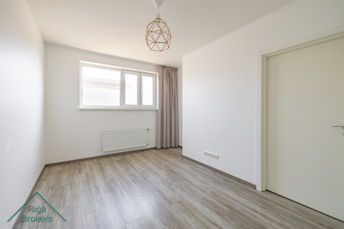 Compact bedroom with two windows