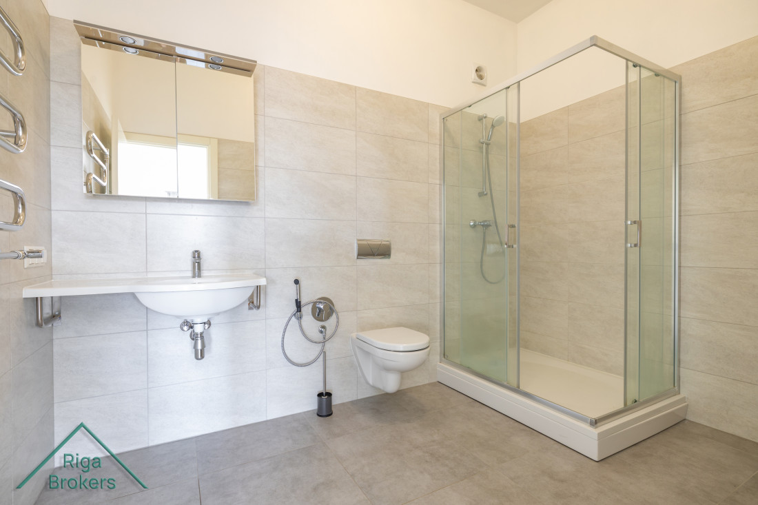 Spacious bathroom with shower cabin