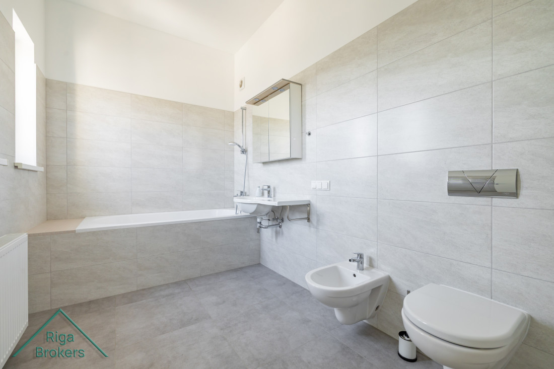 Bathroom with bathtub and bidet