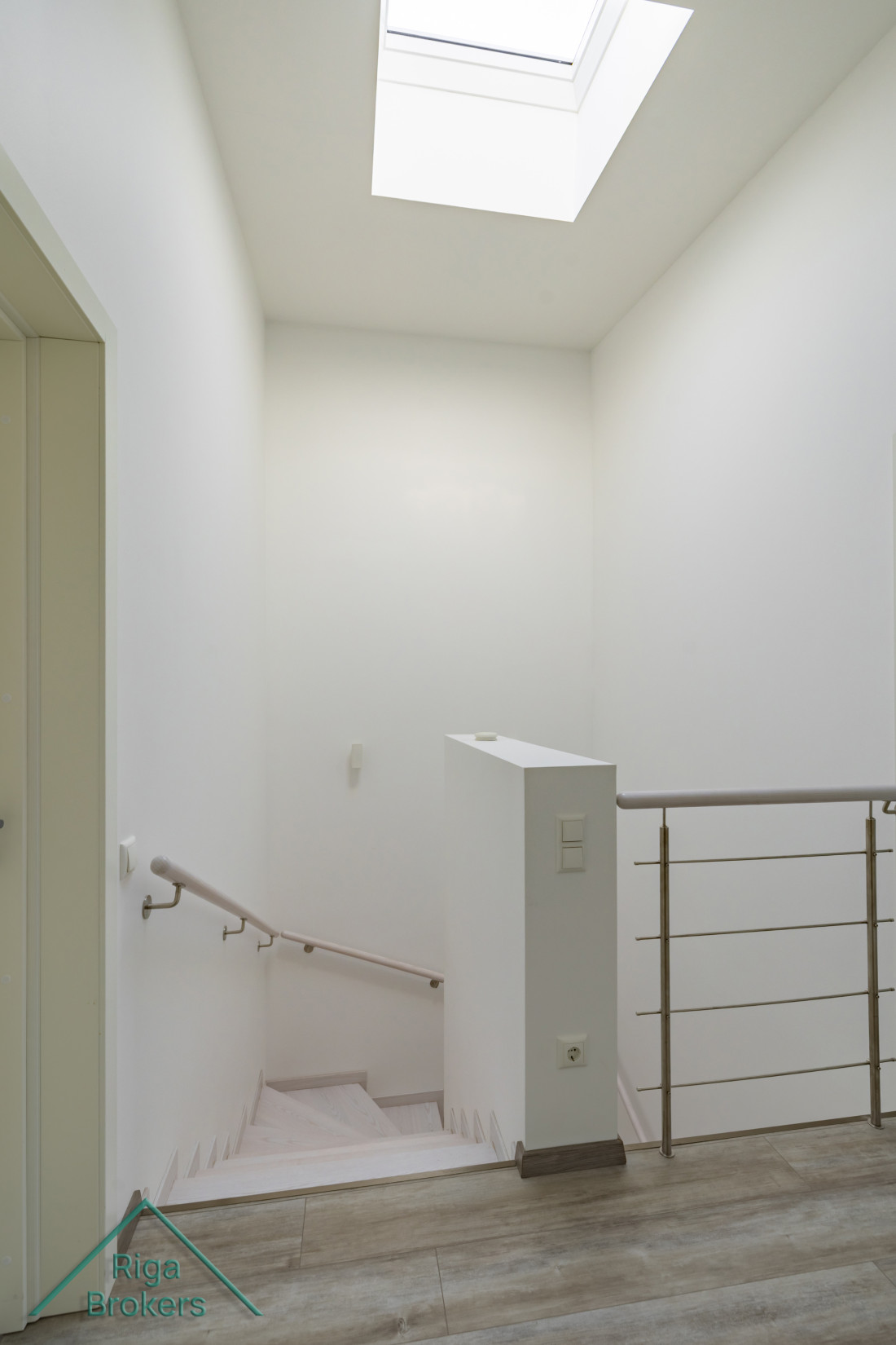 Hallway with stairs to first floor