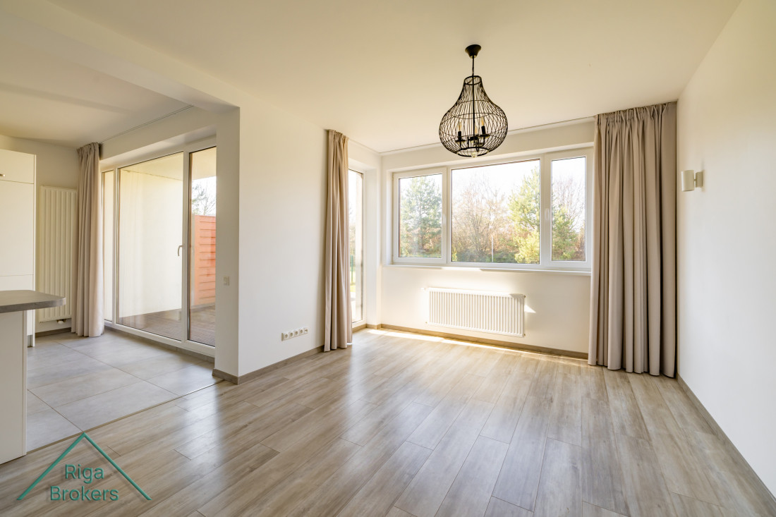 Dining area with large windows and terrace access