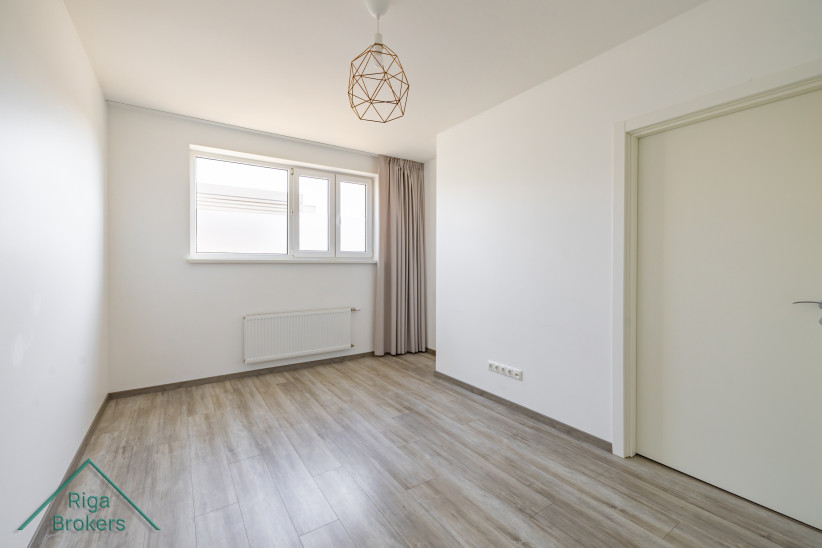 Compact bedroom with two windows