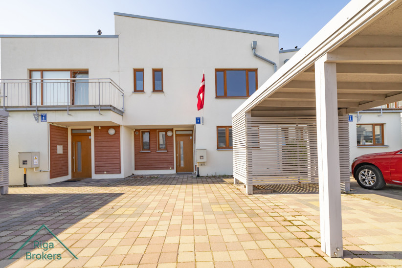 House entrance with Latvian flag