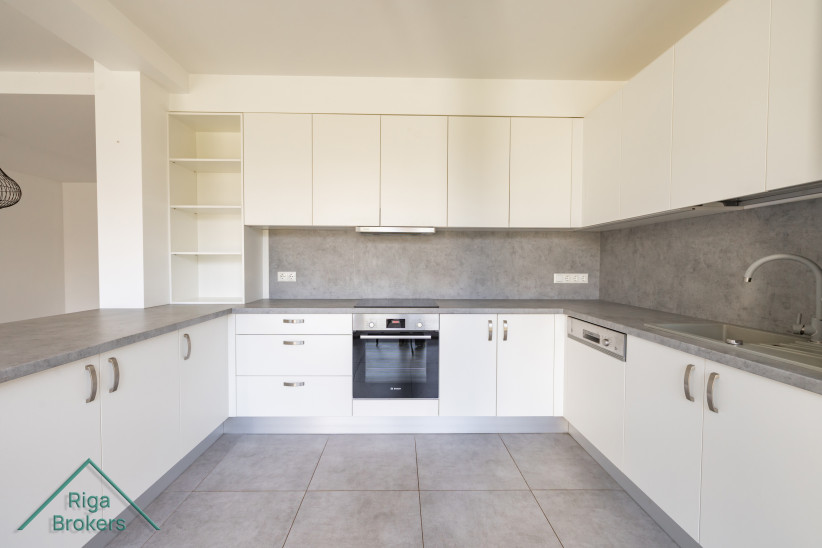 Bright kitchen with built-in appliances