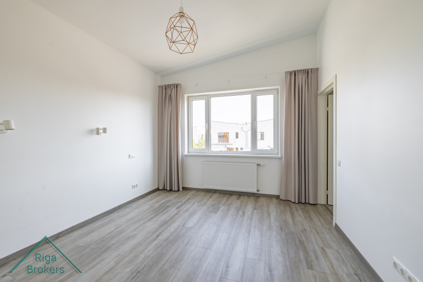 Spacious bedroom with a large window