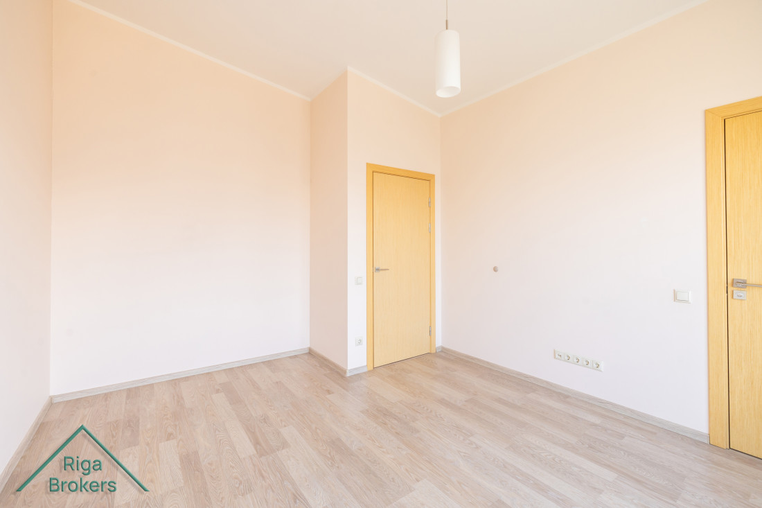 Bright and spacious bedroom with laminate