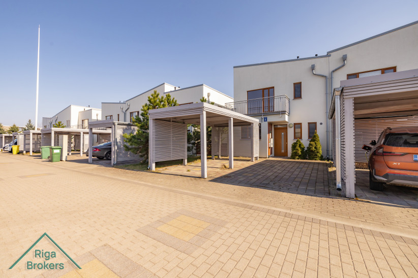 Row of townhouses with parking spaces