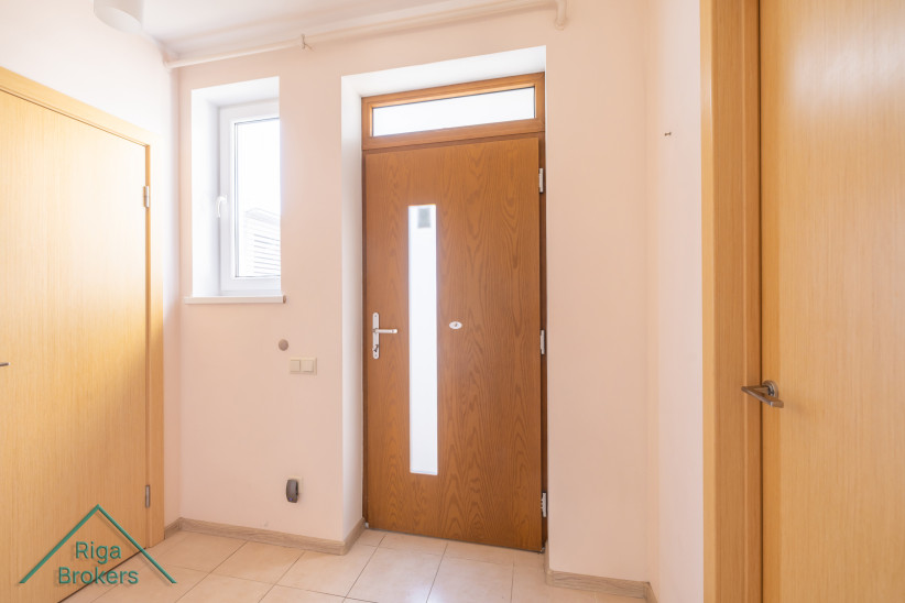 Entrance with wooden door and window