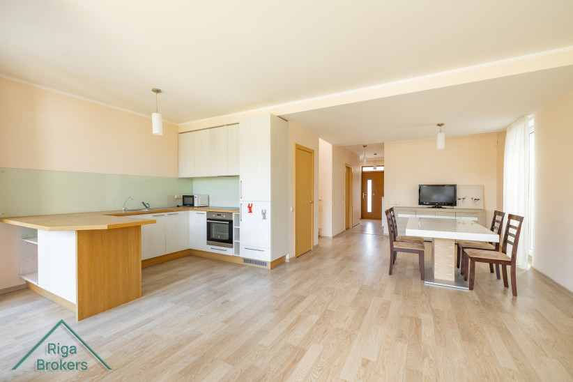 View of kitchen and dining from entrance