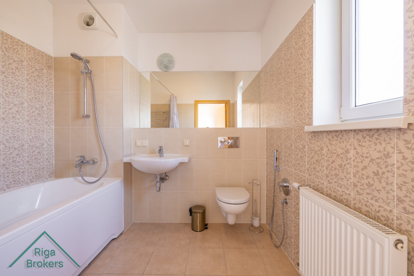 Bathroom with window and toilet