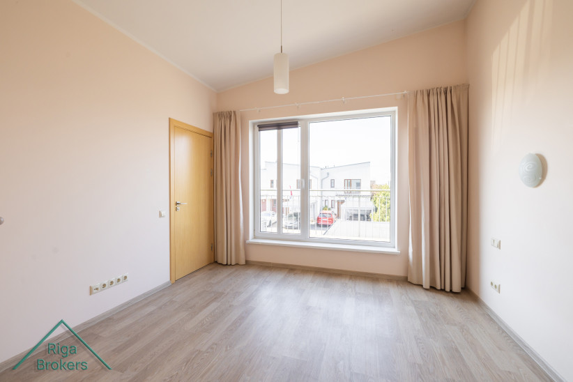 Bright bedroom with large window