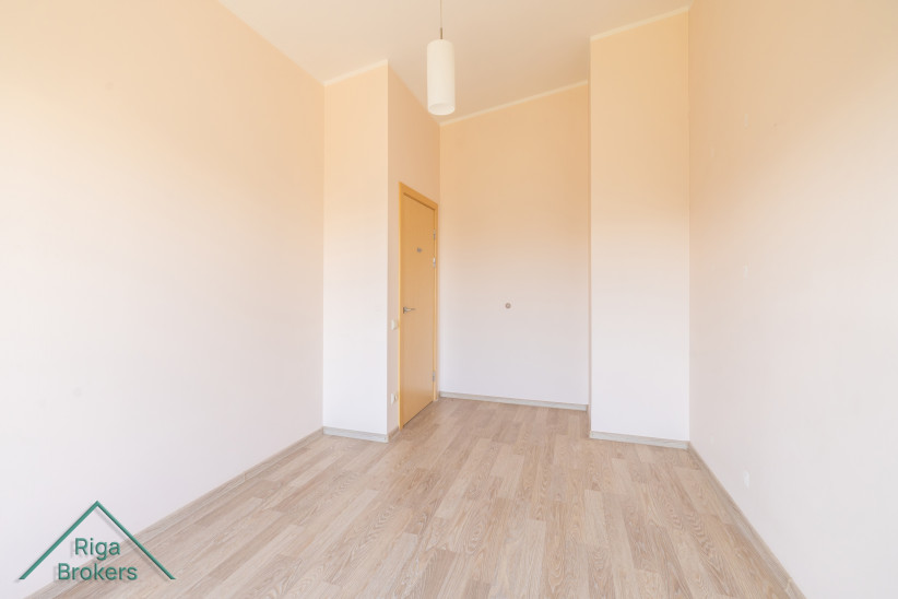 Rectangular room with high ceilings