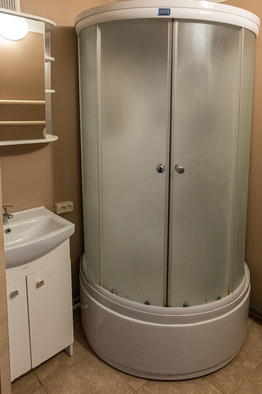 Bathroom with shower cabin and sink