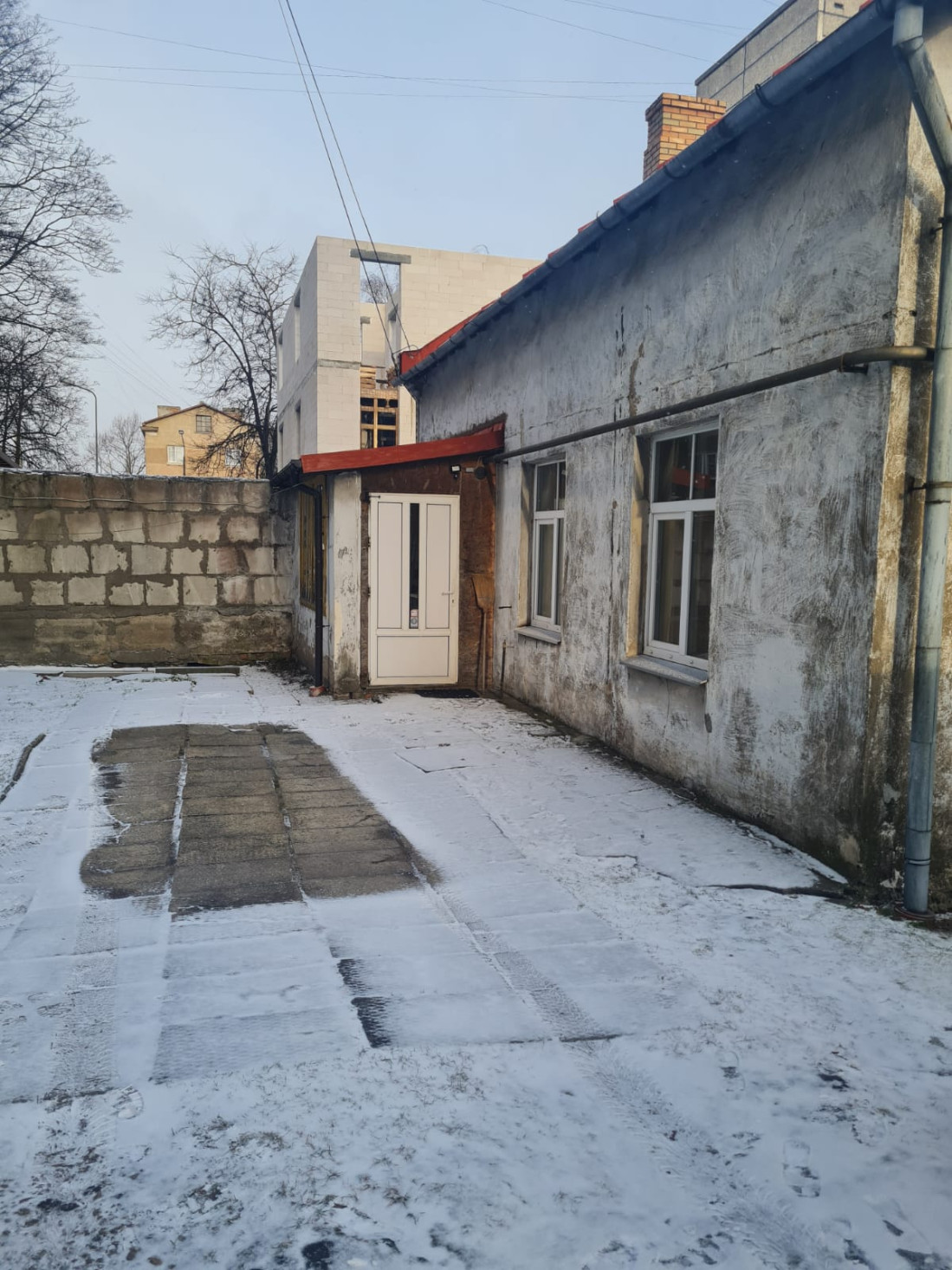 House backyard entrance with snow.