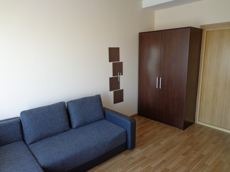Living room with sofa and wardrobe.