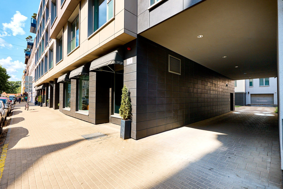 Modern building entrance with arches.