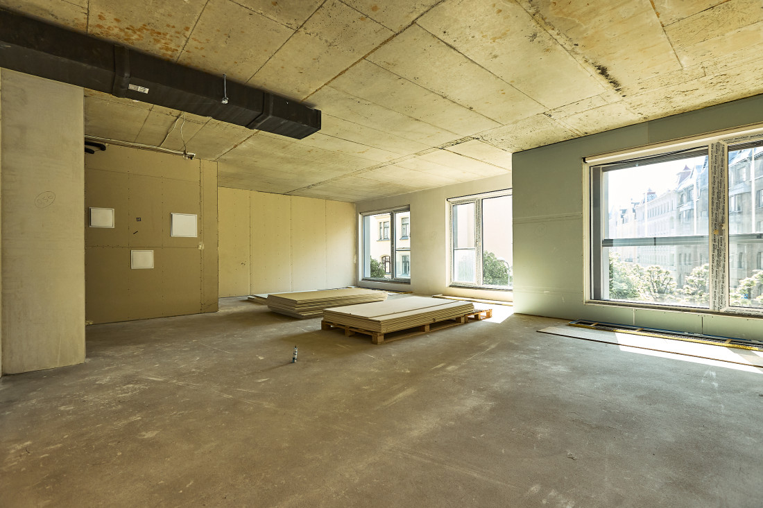 Spacious area with stacked building materials.