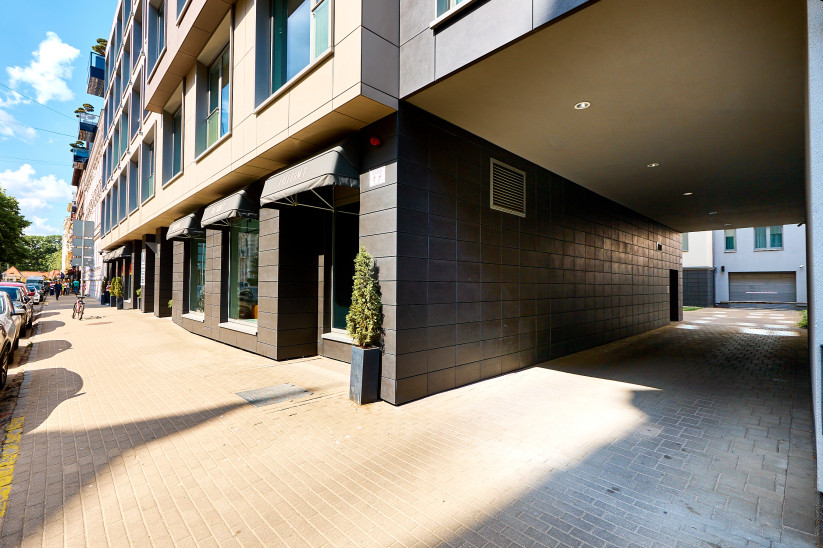 Modern building entrance with arches.