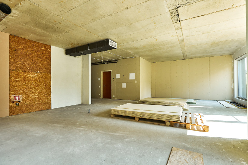 Spacious area with stacked building materials.