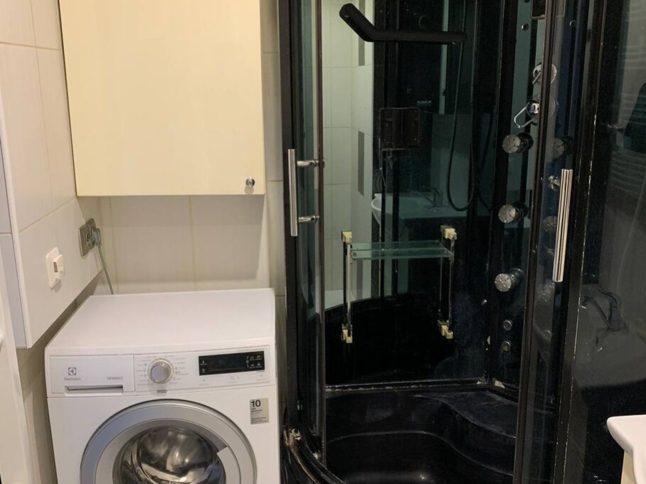 Bathroom with black shower cabin.