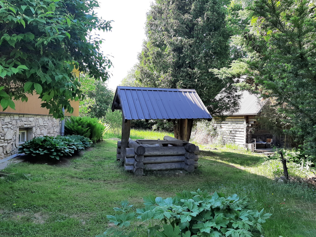 Wooden cabin with a tiled roof.