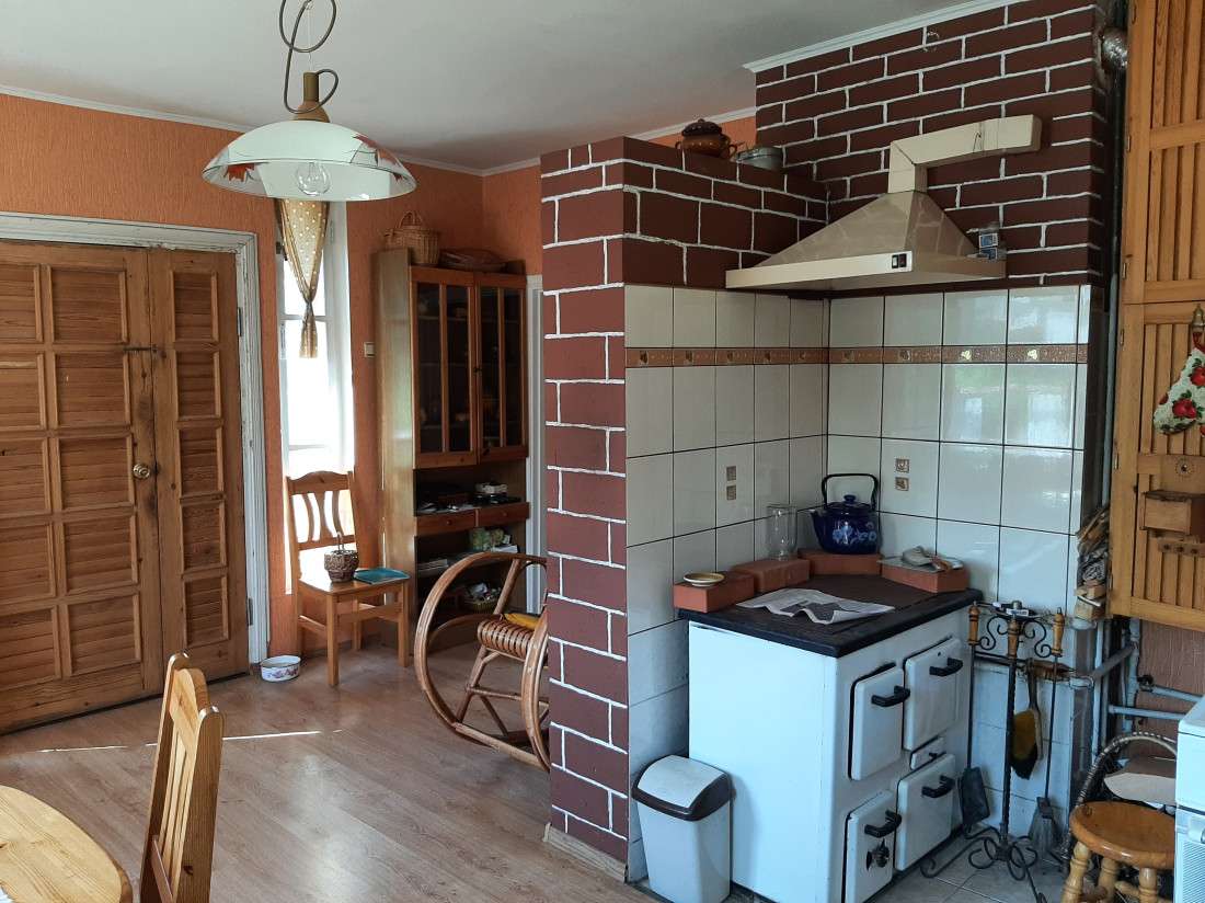 Kitchen with brick walls and stove.
