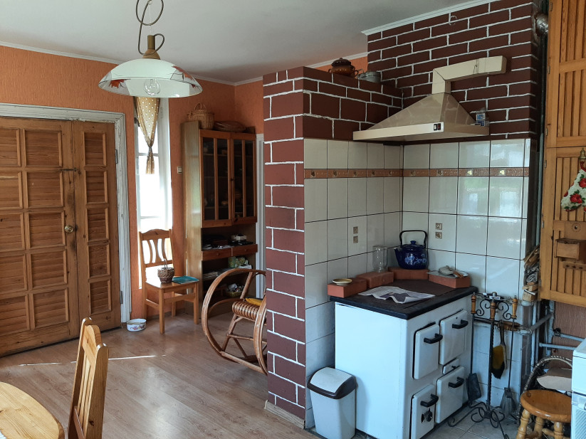 Kitchen with brick walls and stove.