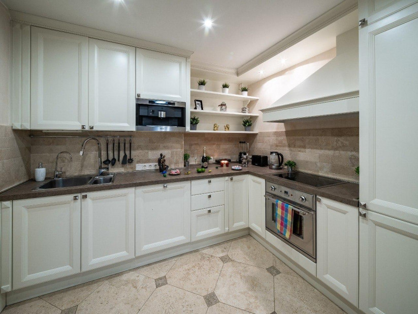 Modern kitchen with light furniture and shelves