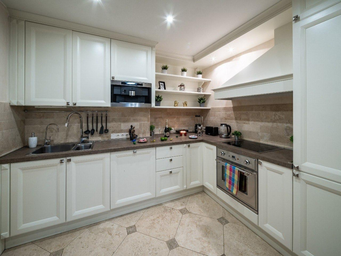 Modern kitchen with light furniture and shelves